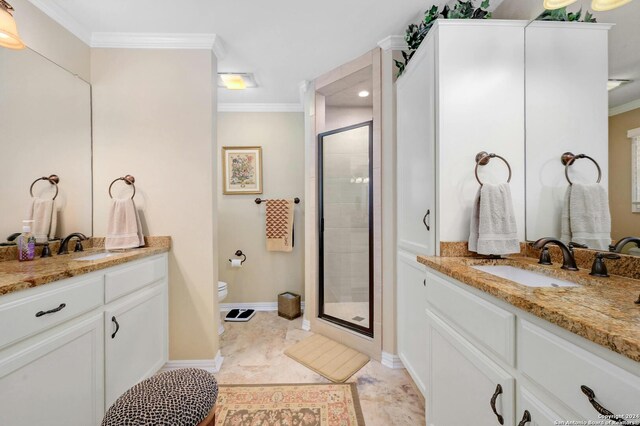 bathroom with walk in shower, ornamental molding, vanity, and toilet