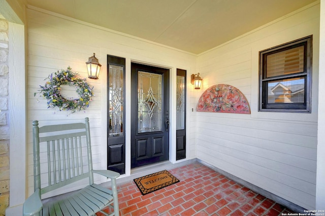 entrance to property with a porch