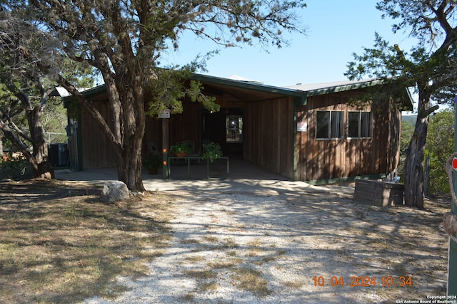 view of property exterior with a carport