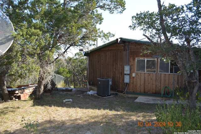 view of home's exterior with central AC