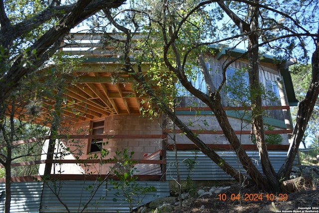 view of home's exterior featuring a wooden deck