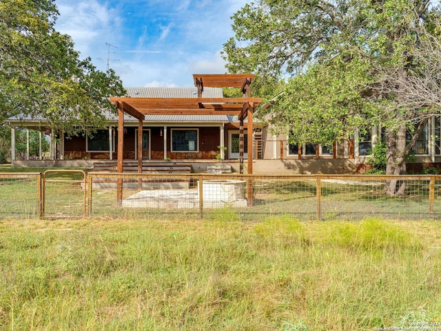 rear view of house with a pergola