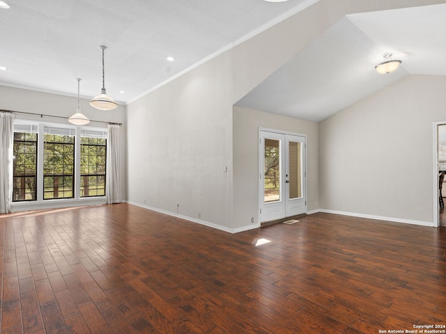 unfurnished living room with crown molding, vaulted ceiling, dark hardwood / wood-style flooring, and french doors