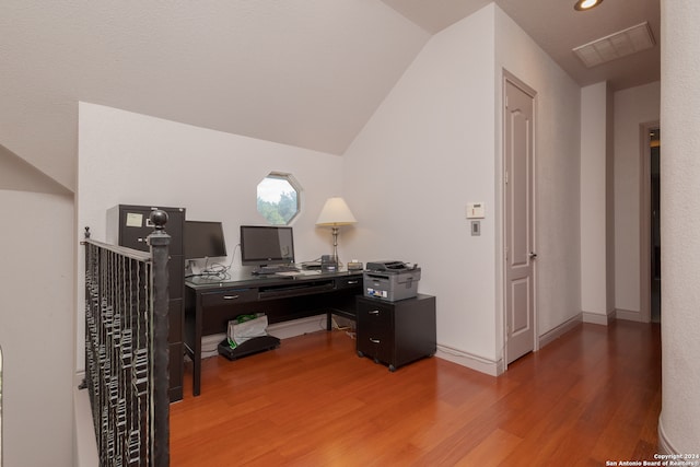 office area with lofted ceiling and hardwood / wood-style floors