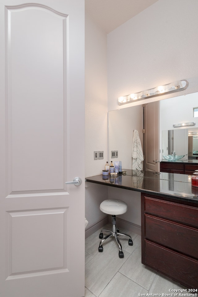 bathroom featuring vanity, toilet, and tile patterned flooring