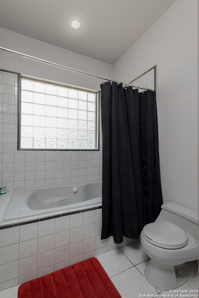 bathroom with toilet, shower / tub combo, and tile patterned flooring