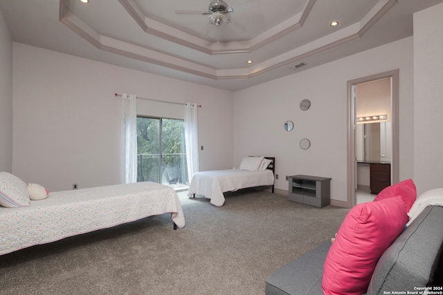 carpeted bedroom with a raised ceiling, ceiling fan, access to exterior, and ensuite bath