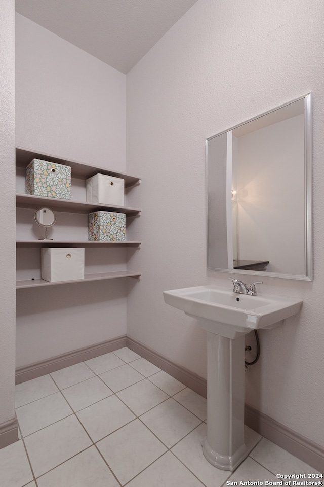 bathroom featuring tile patterned floors and sink