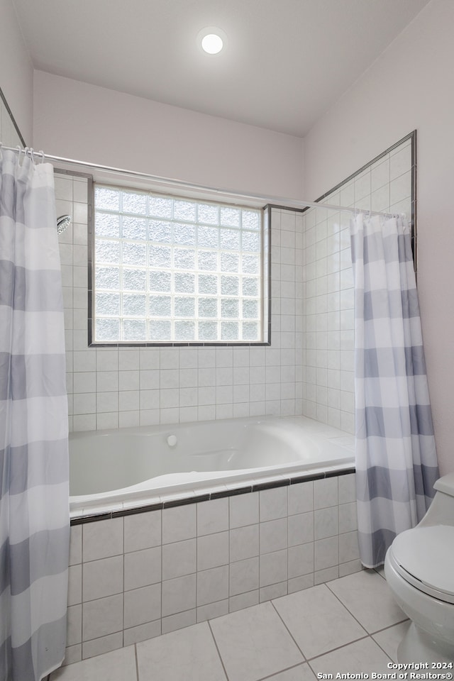 bathroom featuring toilet, shower / bathtub combination with curtain, and tile patterned flooring