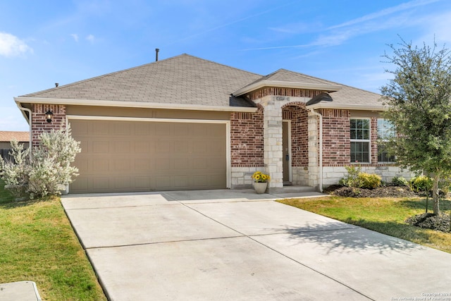 ranch-style house featuring a garage and a front yard