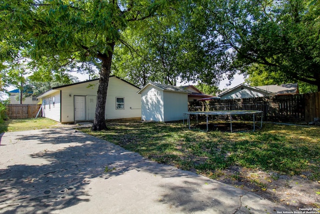 1327 Colima St, San Antonio, TX 78207 - back of property with a trampoline