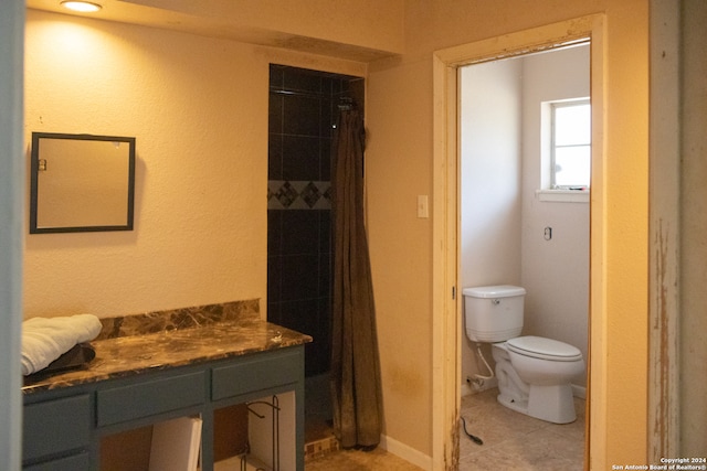 bathroom featuring tile patterned flooring, vanity, toilet, and a shower with curtain