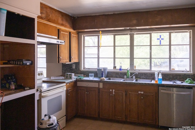 kitchen with light tile patterned floors, range hood, white range with electric stovetop, stainless steel dishwasher, and sink