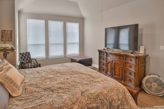 bedroom with lofted ceiling