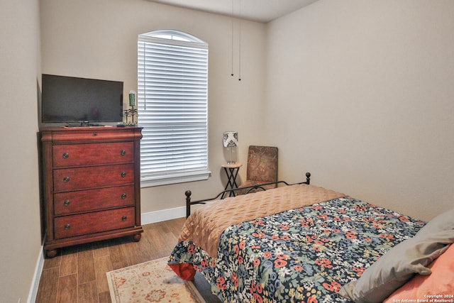 bedroom featuring wood-type flooring