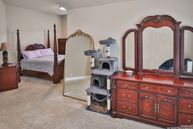 bedroom featuring light colored carpet