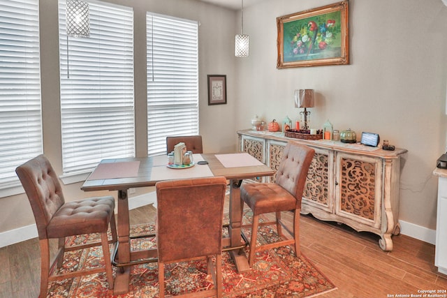 dining space with light hardwood / wood-style flooring