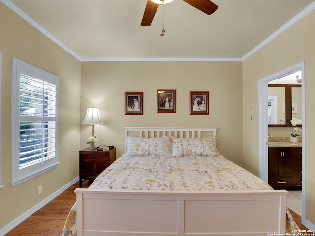 bedroom with light wood-type flooring, connected bathroom, ornamental molding, and ceiling fan