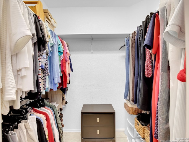 spacious closet featuring light tile patterned floors