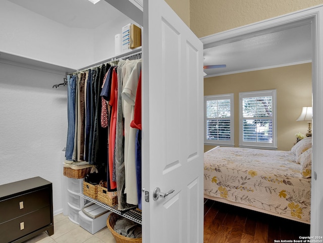 bedroom featuring light hardwood / wood-style flooring and crown molding