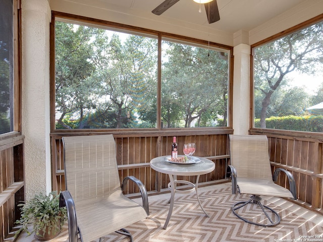 sunroom / solarium with ceiling fan and a healthy amount of sunlight