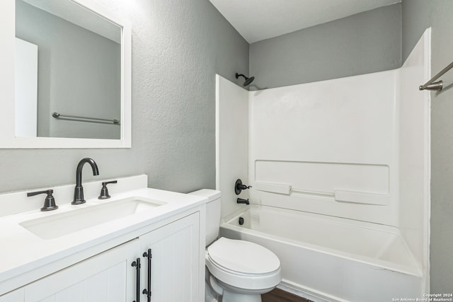 full bathroom with vanity, toilet, shower / washtub combination, and hardwood / wood-style flooring