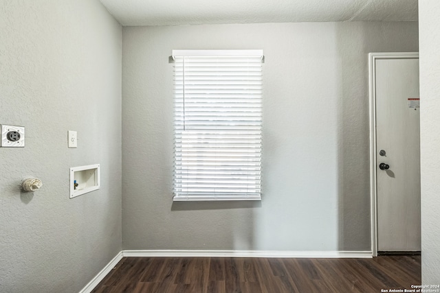 clothes washing area with hookup for a washing machine, dark hardwood / wood-style flooring, and hookup for an electric dryer