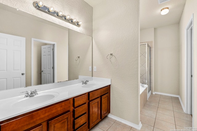 bathroom with tile patterned floors and vanity