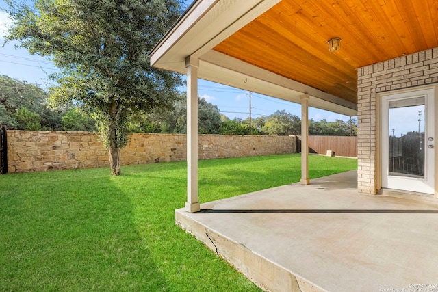 view of yard featuring a patio area and a fenced backyard