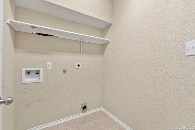 laundry area featuring hookup for a washing machine, gas dryer hookup, hookup for an electric dryer, and light tile patterned floors