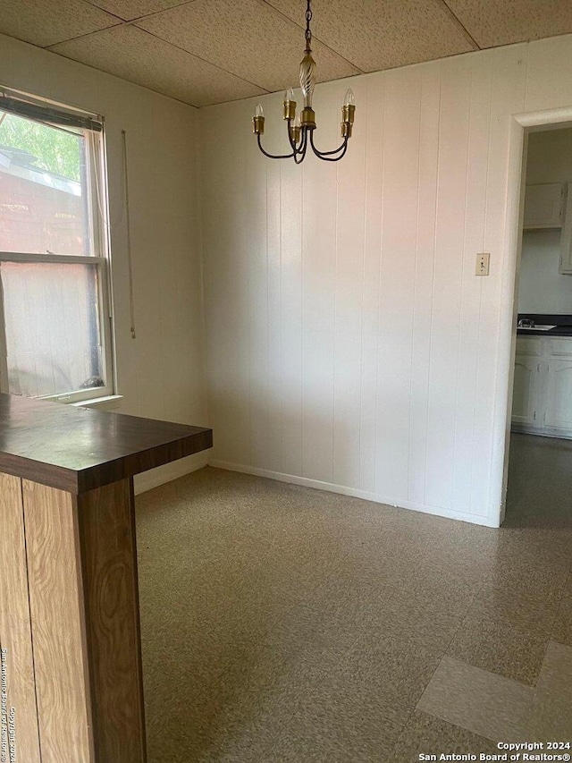 2019 Martin Luther King Dr, San Antonio, TX 78203 - unfurnished dining area with an inviting chandelier and a drop ceiling