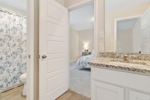 3443 Iron Cyn, Bulverde, TX 78163 - full bathroom with ensuite bathroom, vanity, a shower with curtain, baseboards, and toilet