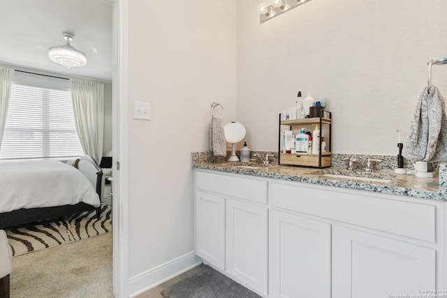 3443 Iron Cyn, Bulverde, TX 78163 - full bathroom with ensuite bathroom, baseboards, a sink, and double vanity