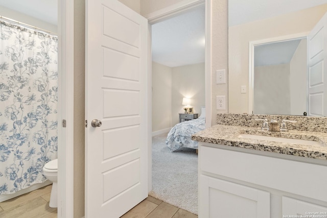 bathroom with vanity and toilet