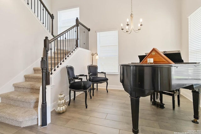 3443 Iron Cyn, Bulverde, TX 78163 - sitting room with a wealth of natural light, wood finished floors, an inviting chandelier, and stairway