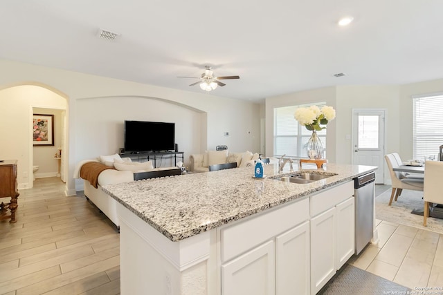 3443 Iron Cyn, Bulverde, TX 78163 - kitchen with stainless steel dishwasher, a sink, visible vents, a ceiling fan, and light stone counters