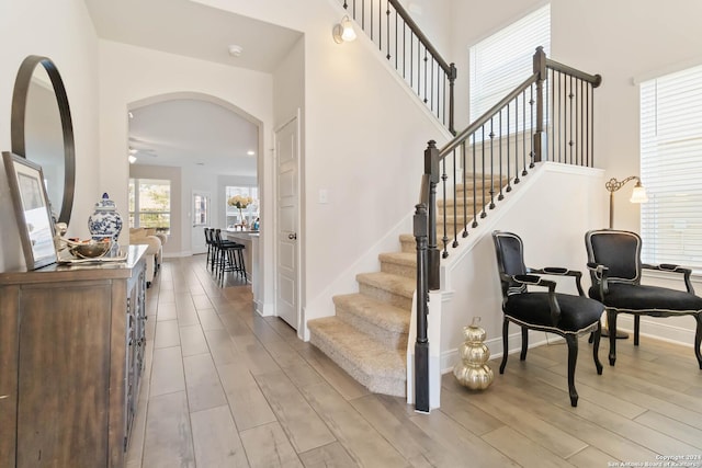3443 Iron Cyn, Bulverde, TX 78163 - stairs featuring baseboards, wood finished floors, arched walkways, and ceiling fan