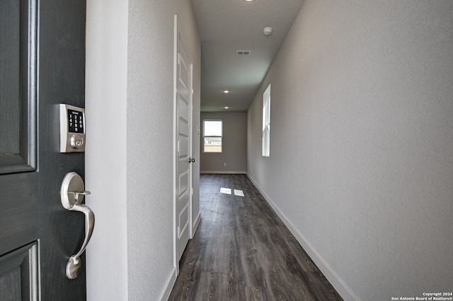 hallway featuring dark wood-type flooring