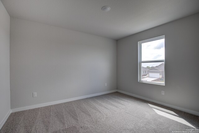 empty room with carpet flooring