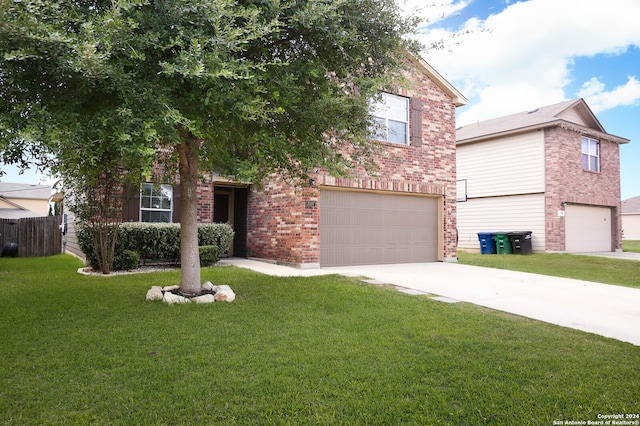 view of front of property with a garage and a front yard