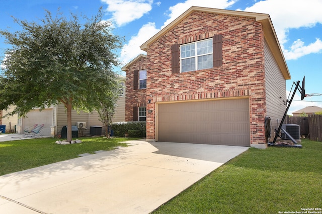 front of property featuring a garage, central AC unit, and a front yard