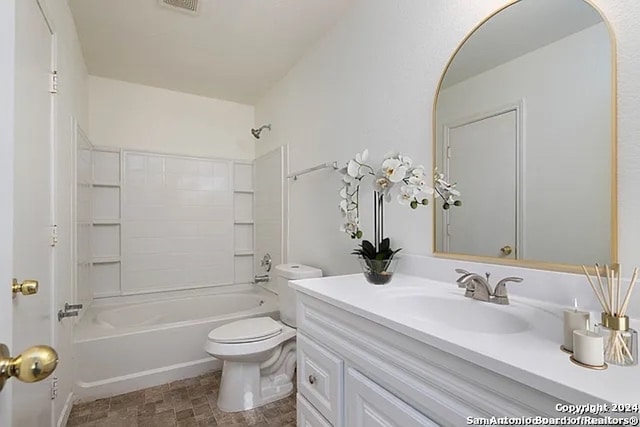 full bathroom featuring bathing tub / shower combination, vanity, and toilet