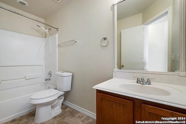 full bathroom with vanity, toilet, and washtub / shower combination