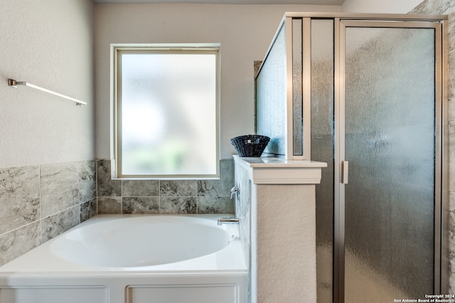 bathroom with independent shower and bath