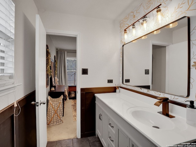 bathroom featuring tile patterned floors and vanity