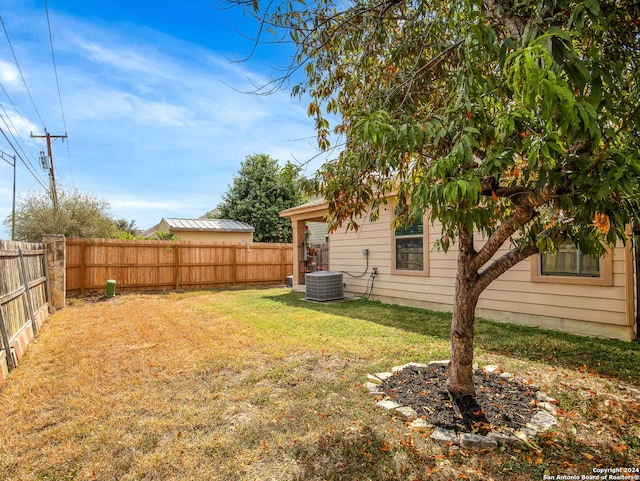 view of yard with central AC unit