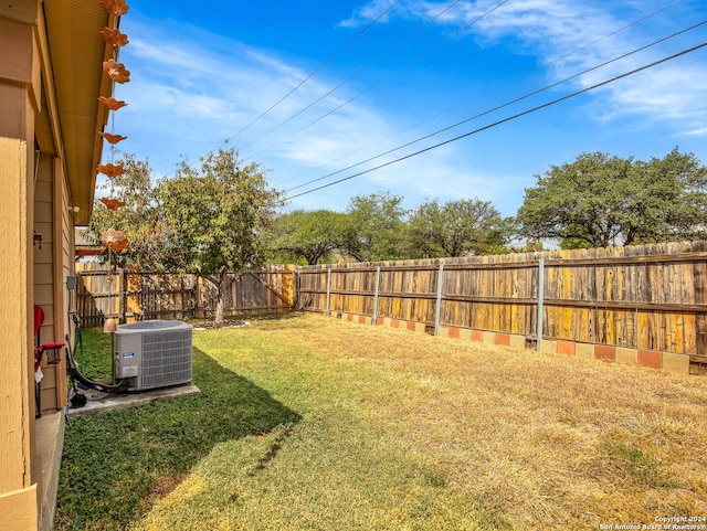 view of yard with central AC unit