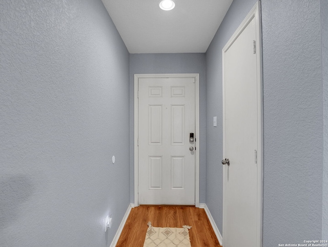 doorway to outside with light wood-type flooring