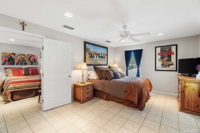 tiled bedroom with ceiling fan