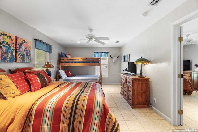 tiled bedroom with ceiling fan